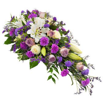Rouwarrangement in het wit en lila/paarse tinten Rouwarrangementen Bloemenpaleis Verhagen 
